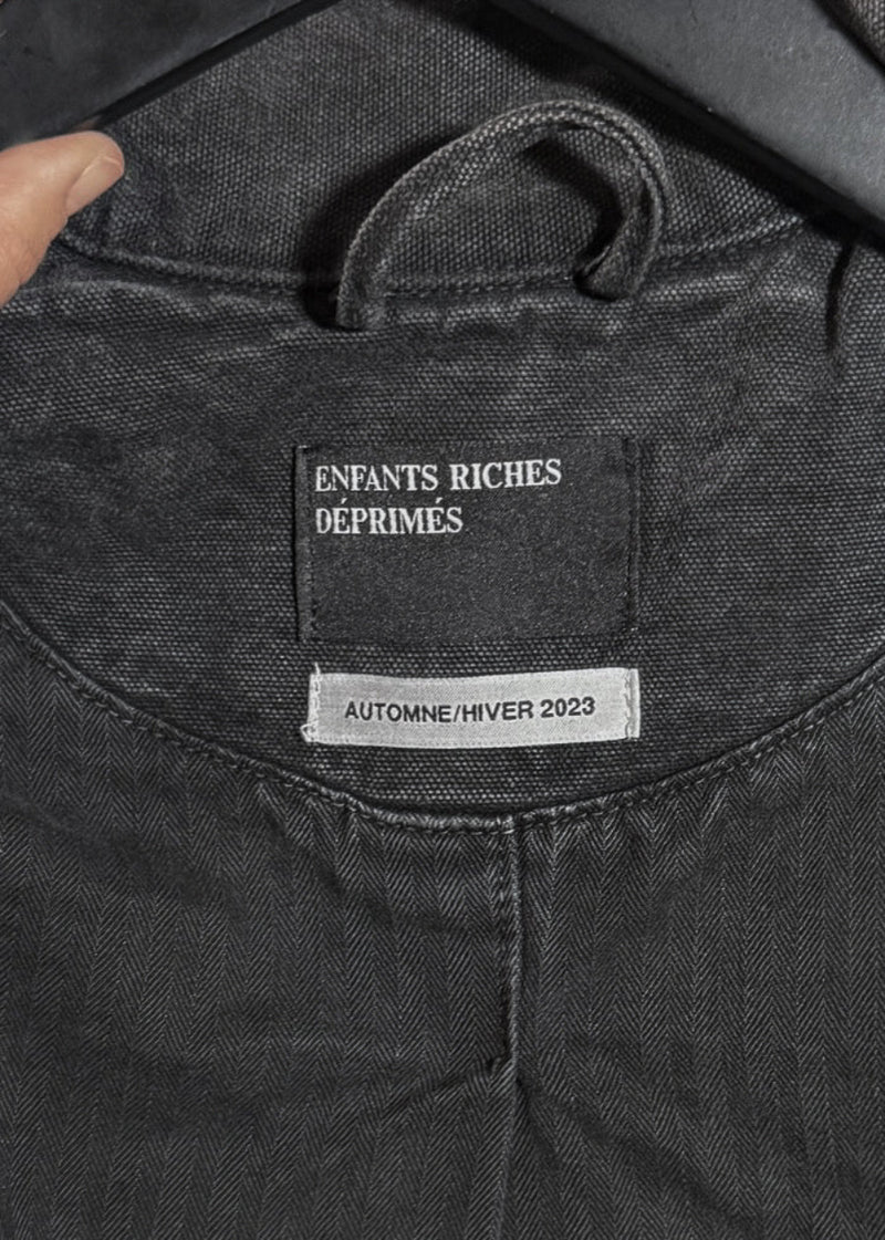 Brand label of Enfants Riches Déprimés FW23 Washed Black Italian Romance Denim Jacket