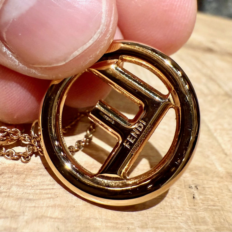 Close up on Fendi F is Fendi Gold Tone F Pendant Necklace