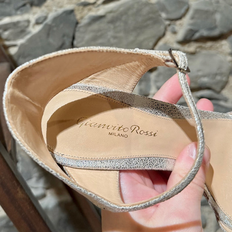 A branded insole of Gianvitto Rossi Silver Metallic Ankle Strap Sandals