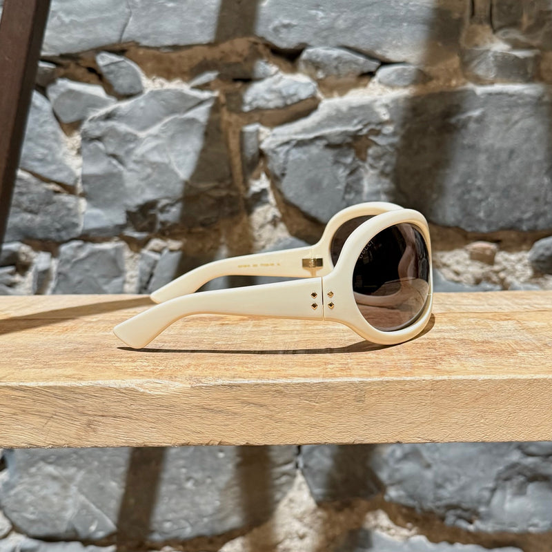 A side view of Gucci 1381 Beige Shield Frame Injection Sunglasses