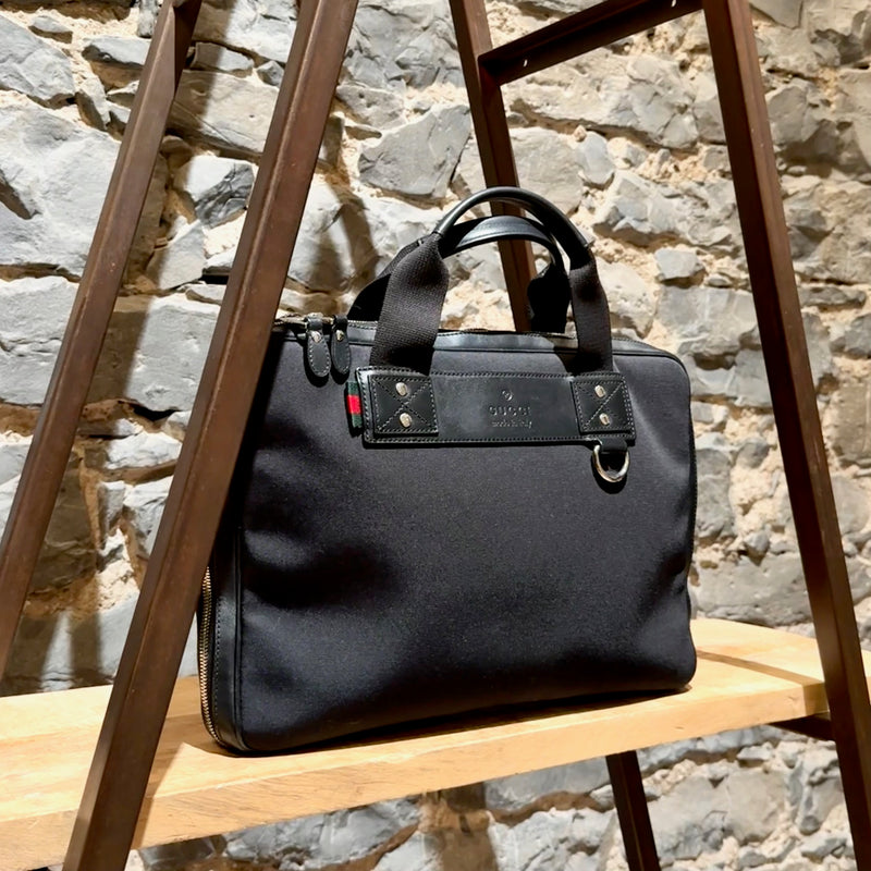 Side front view of Gucci Black Canvas Leather Sherry Line Business Bag