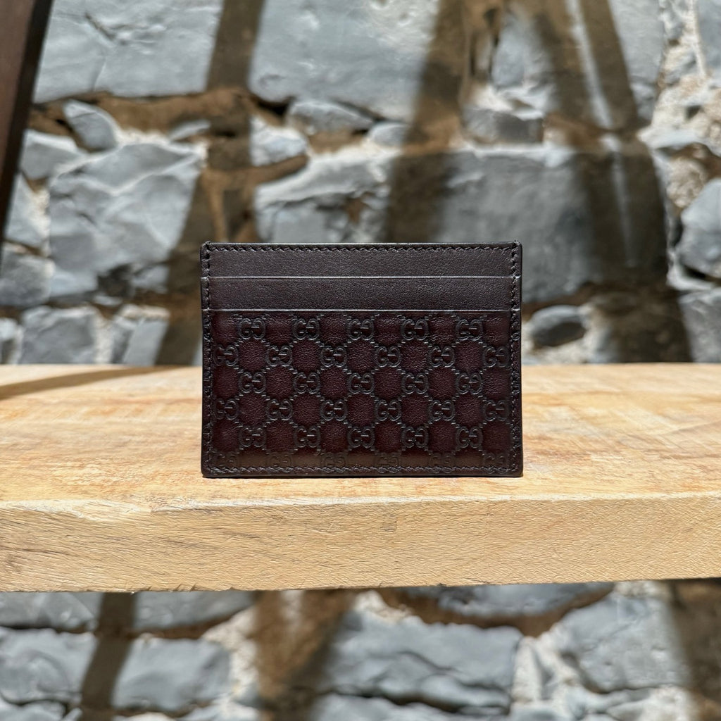 A side view of Gucci Brown Microguccissima Card Holder