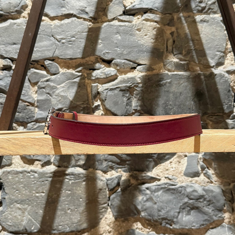 A side view of Gucci GG Burgundy Leather Crystal GG Buckle Belt