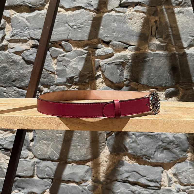 A side view of Gucci GG Burgundy Leather Crystal GG Buckle Belt