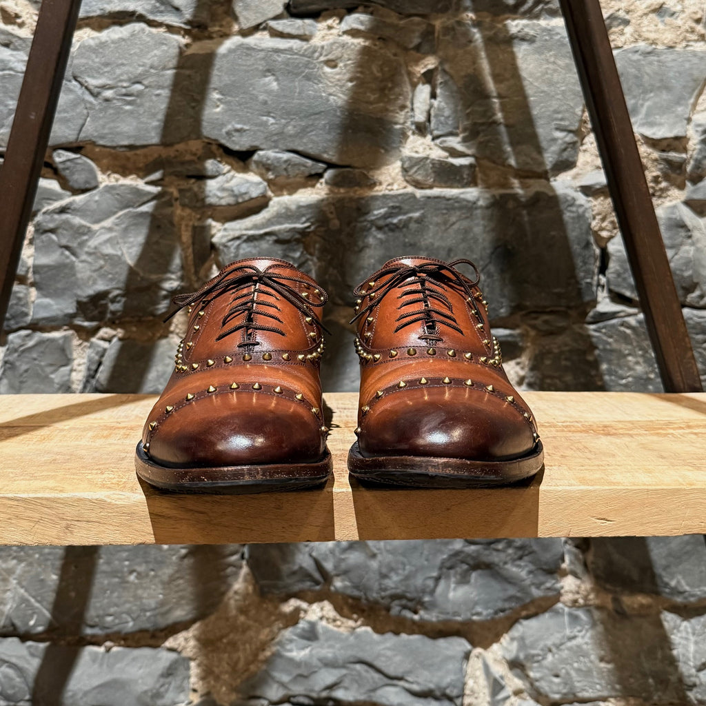 Front view of Gucci Studded Brown Leather Lace-up Shoes