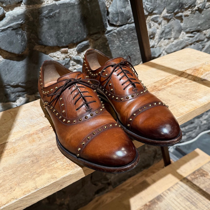 Toe box of Gucci Studded Brown Leather Lace-up Shoes