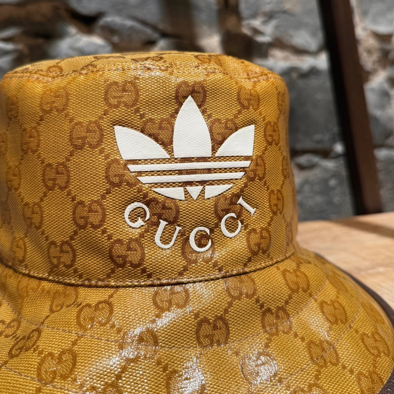 Close up on logo of Gucci X Adidas Brown Logo GG Crystal Bucket Hat