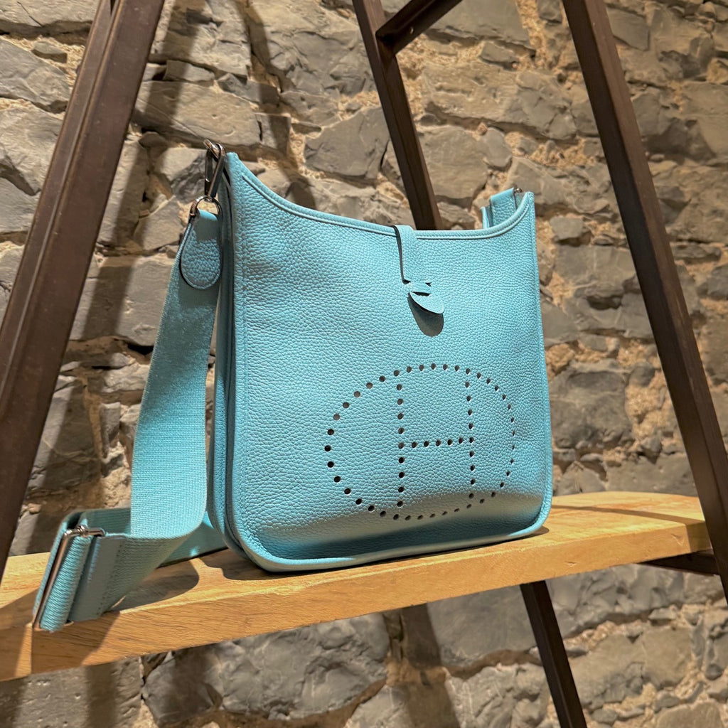 Side front view of Hermès 2015 Bleu Atoll Clemence Evelyne III Crossbody Bag