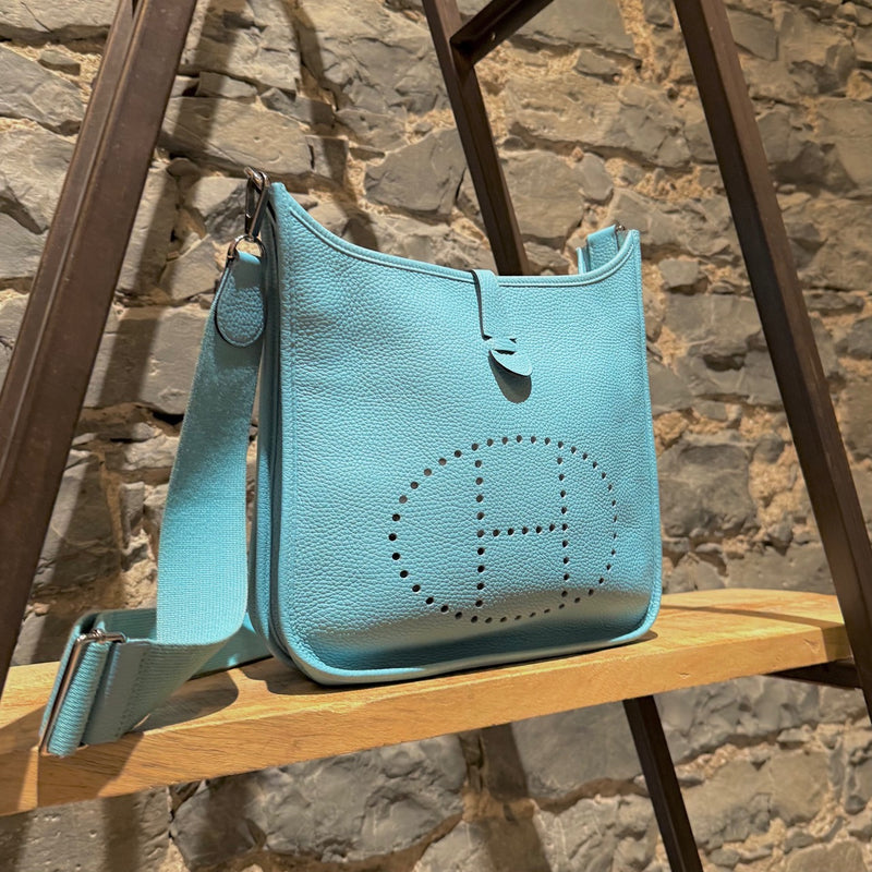 Side front view of Hermès 2015 Bleu Atoll Clemence Evelyne III Crossbody Bag