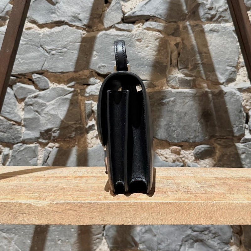 A side view of Hermès 2021 Limited Edition Black Monsieur Studio Disco Mini Constance III 18 Bag