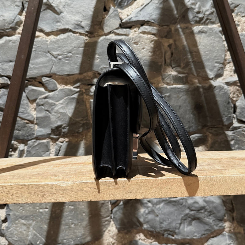 A side view of Hermès 2021 Limited Edition Black Monsieur Studio Disco Mini Constance III 18 Bag