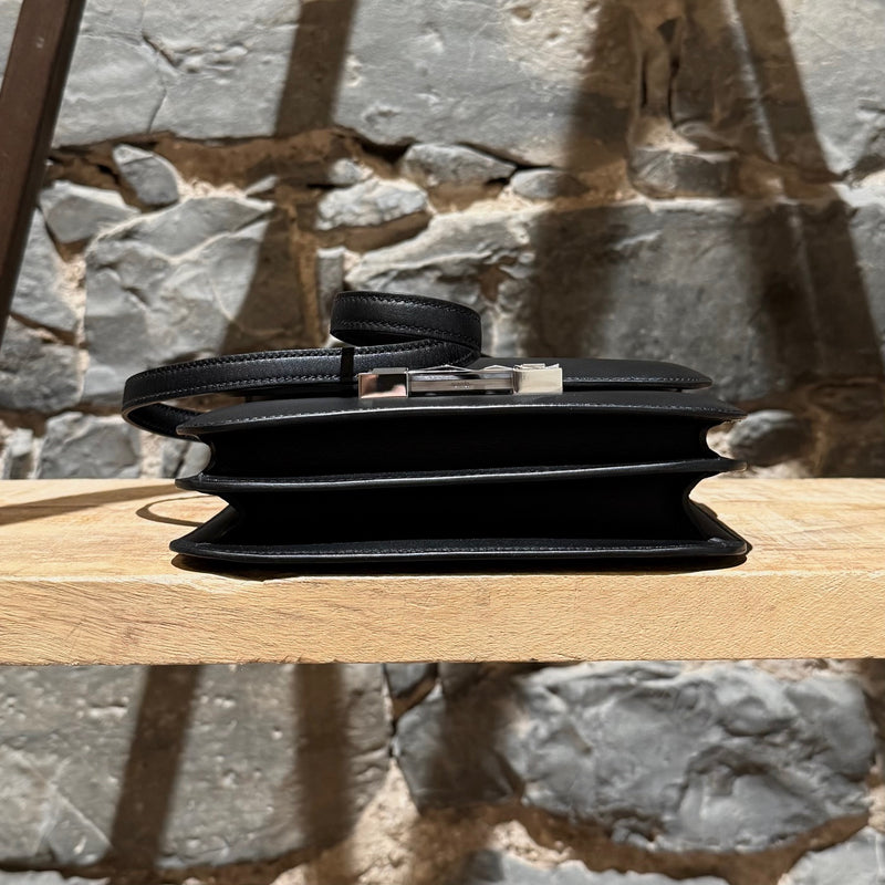 Bottom view of Hermès 2021 Limited Edition Black Monsieur Studio Disco Mini Constance III 18 Bag