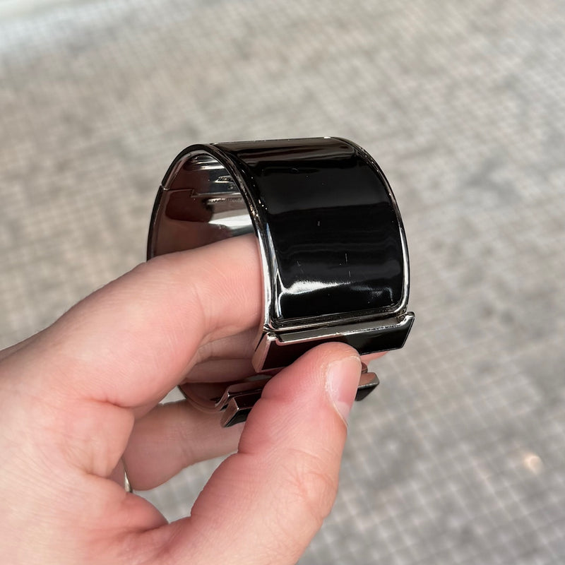 Close-up on Hermès Black Enamel Extra Wide Clic Clac H PHW Bracelet