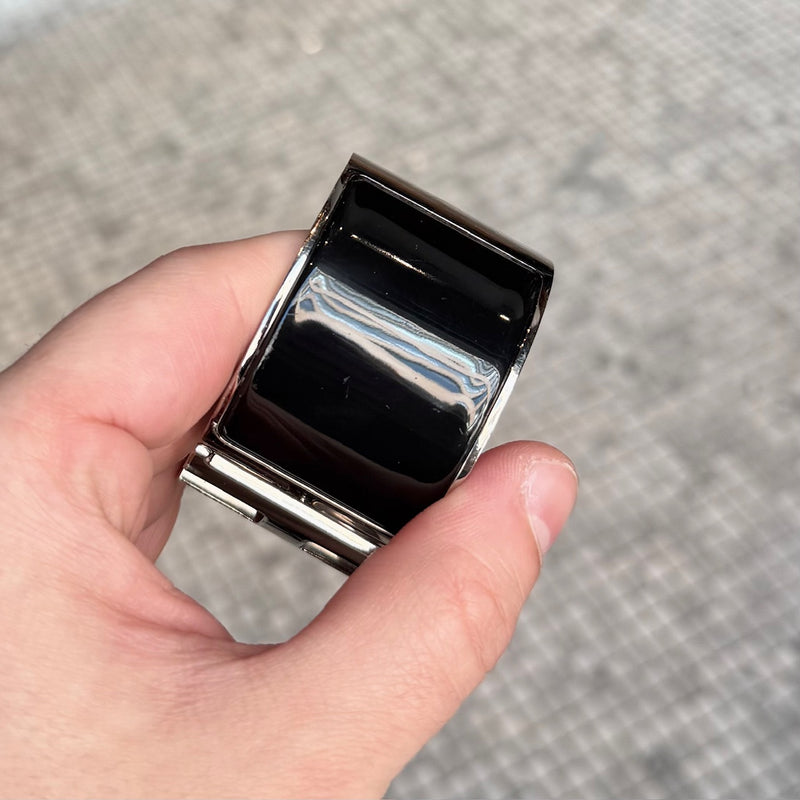 Close-up on Hermès Black Enamel Extra Wide Clic Clac H PHW Bracelet