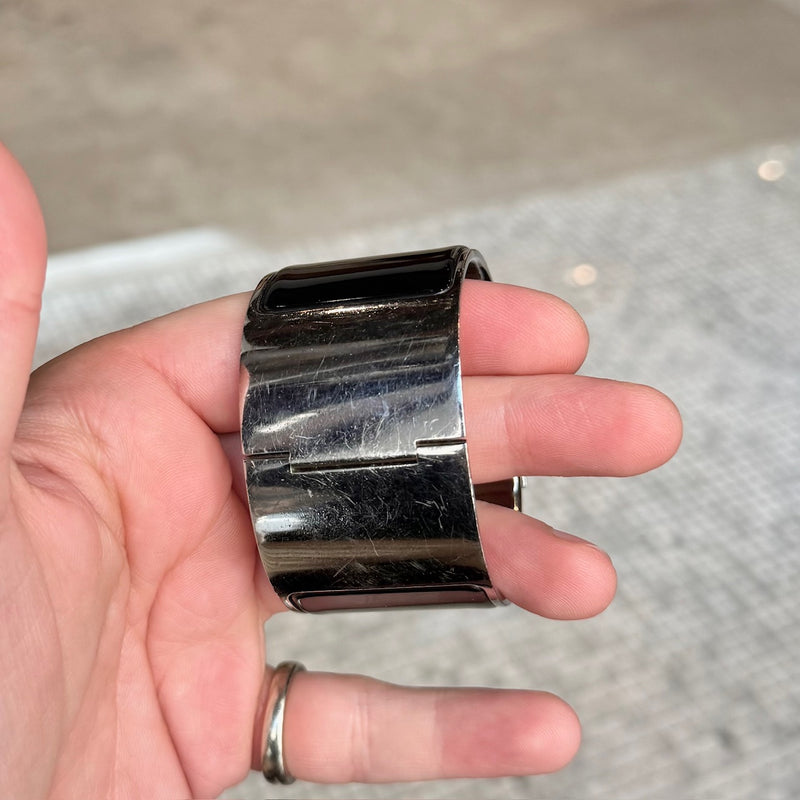 Close-up on Hermès Black Enamel Extra Wide Clic Clac H PHW Bracelet