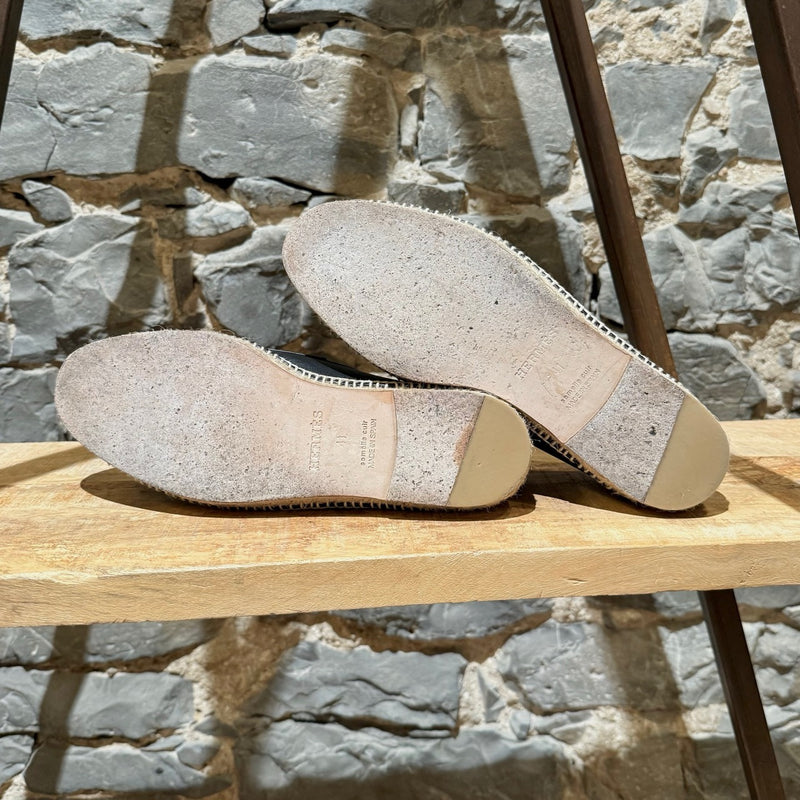 Branded outsole of Hermès Black Leather Trip H Mocassin Espadrilles