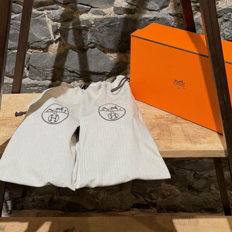 Branded box and dustbags of Hermès Black Nylon Electric Criss Cross Sandals