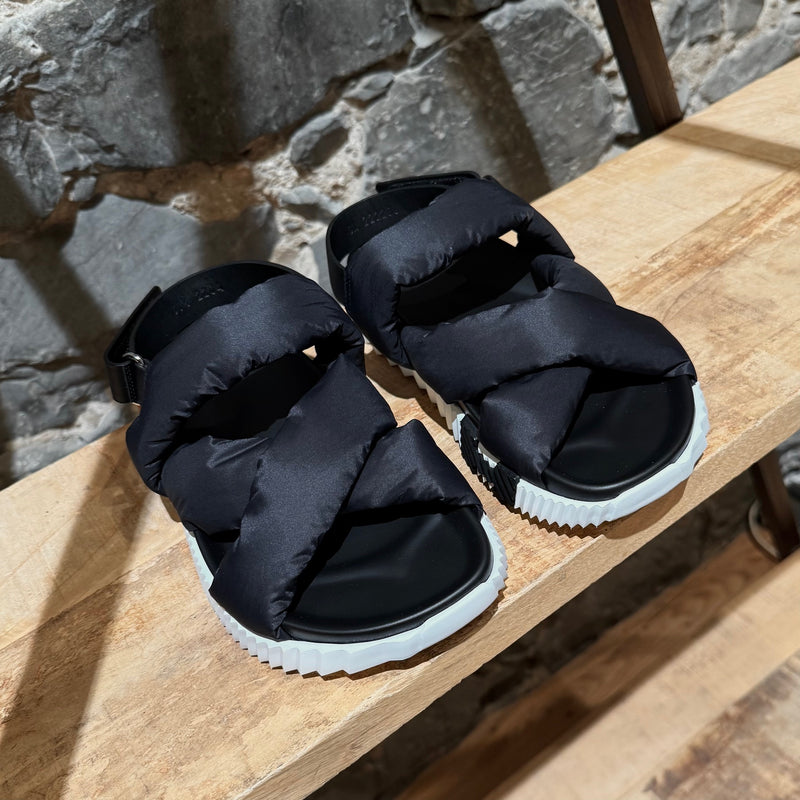 Side front view of Hermès Black Nylon Electric Criss Cross Sandals