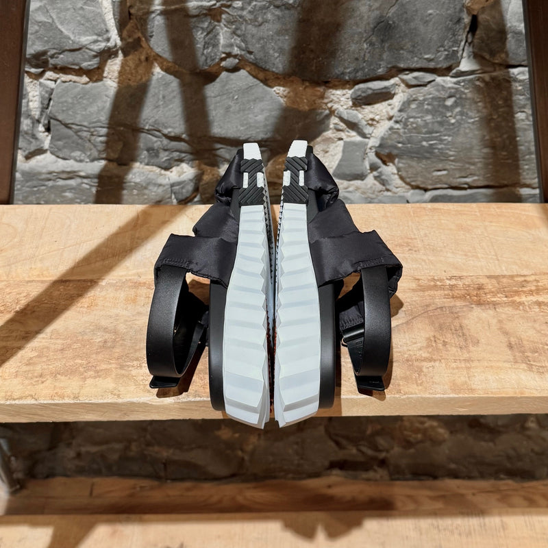 Side-by-side view of Hermès Black Nylon Electric Criss Cross Sandals