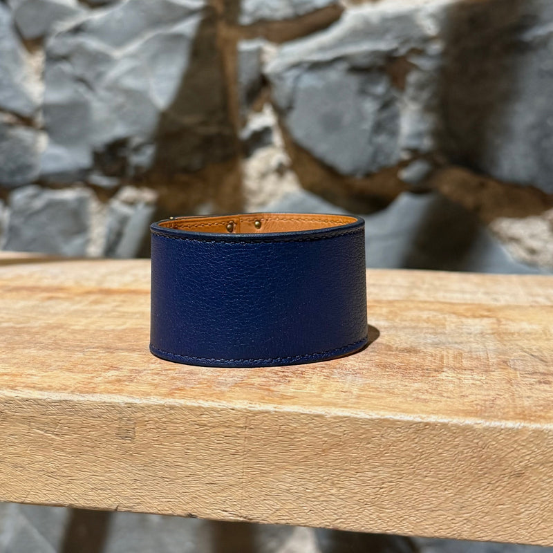 Back view of Hermès Blue Saphir Swift Leather Gold Plated Kelly Dog Bracelet