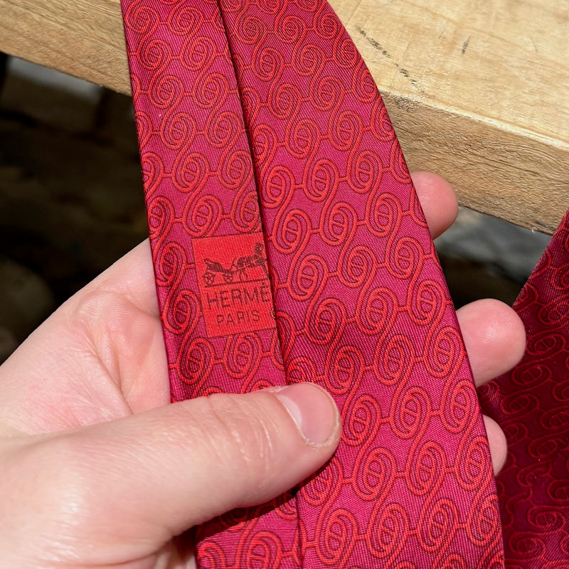 Light stain on Hermès Chaine D'Ancre Pattern Raspberry Red Tonal Silk Tie