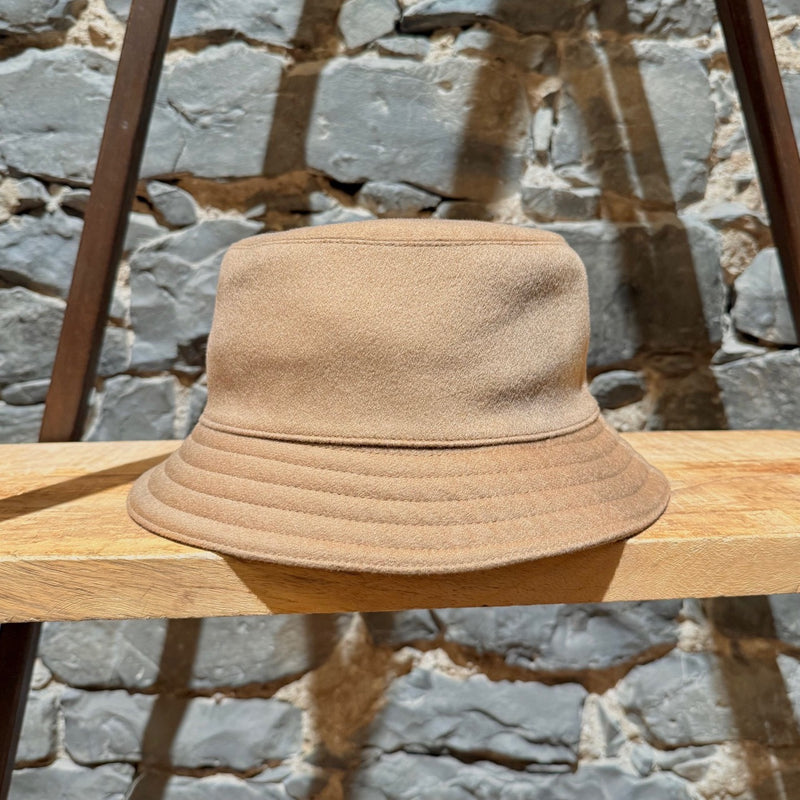 A side view of Hermès Harper H Sellier Beige Cashmere Bucket Hat