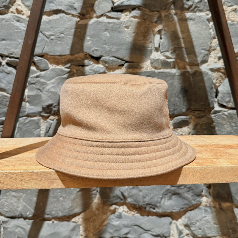 A side view of Hermès Harper H Sellier Beige Cashmere Bucket Hat