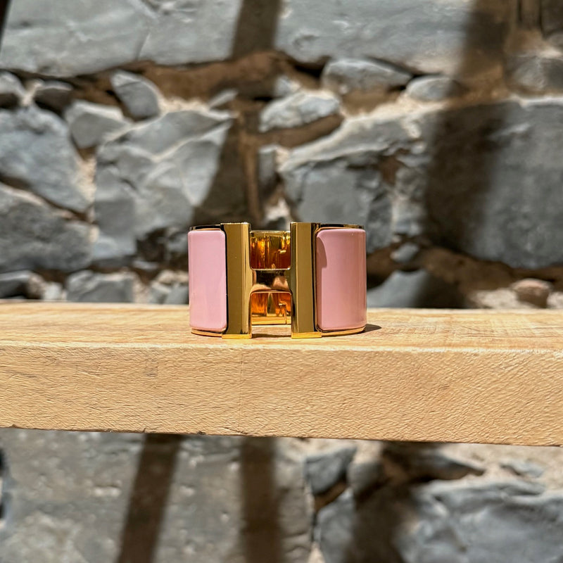 Front view of Hermès Pink Enamel Extra Wide Clic Clac H Gold Plated Bracelet