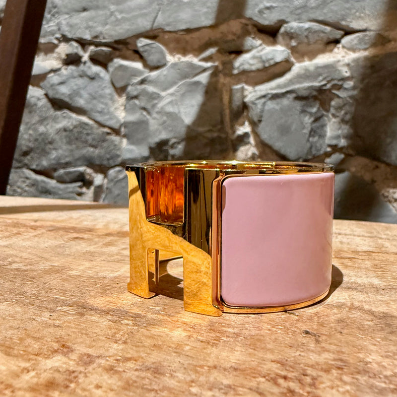 Side front view of Hermès Pink Enamel Extra Wide Clic Clac H Gold Plated Bracelet