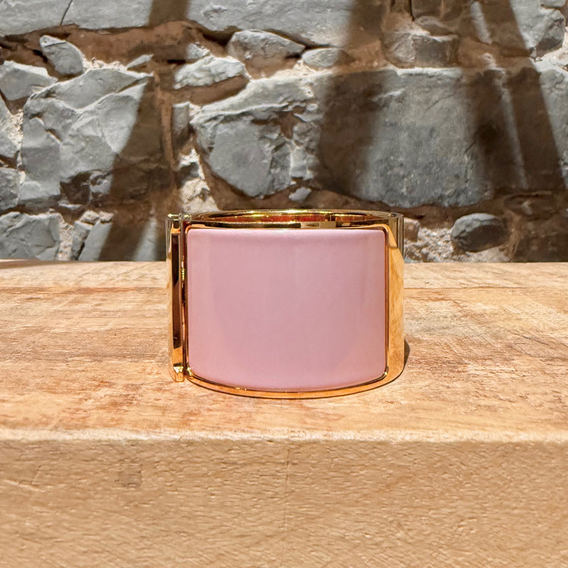 A side view of Hermès Pink Enamel Extra Wide Clic Clac H Gold Plated Bracelet