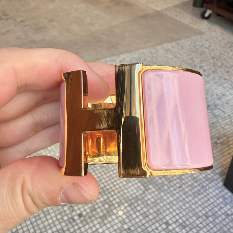 Close-up on Hermès Pink Enamel Extra Wide Clic Clac H Gold Plated Bracelet
