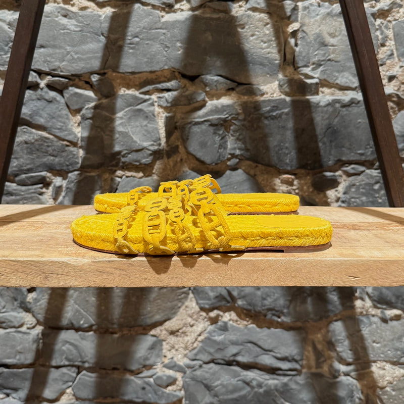 A side view of Hermès Yellow Ancone Thalassa Chaine d'Ancre Sandals