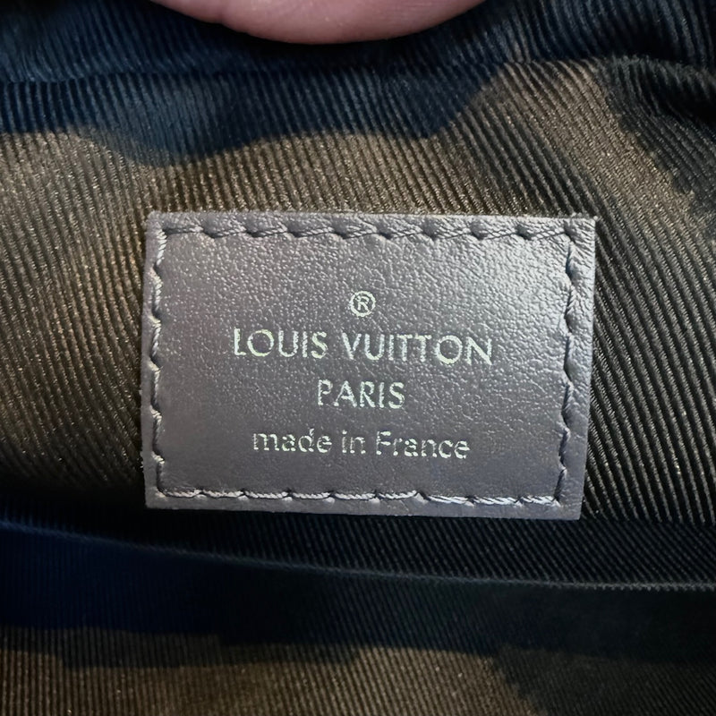 Branded patch close up of Louis Vuitton 2021 Blue Grey Monogram Shadow Duo Messenger Bag