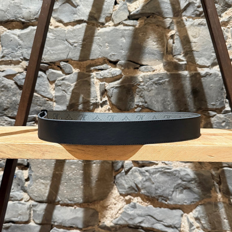 A Black side view of Louis Vuitton 2022 Grey Taurillon Monogram Flower LV Shape Reversible Belt