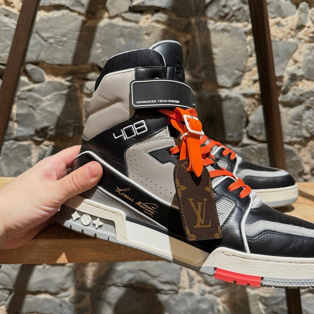 A side view of Louis Vuitton Black Grey LV Trainer 408 High-top Sneakers