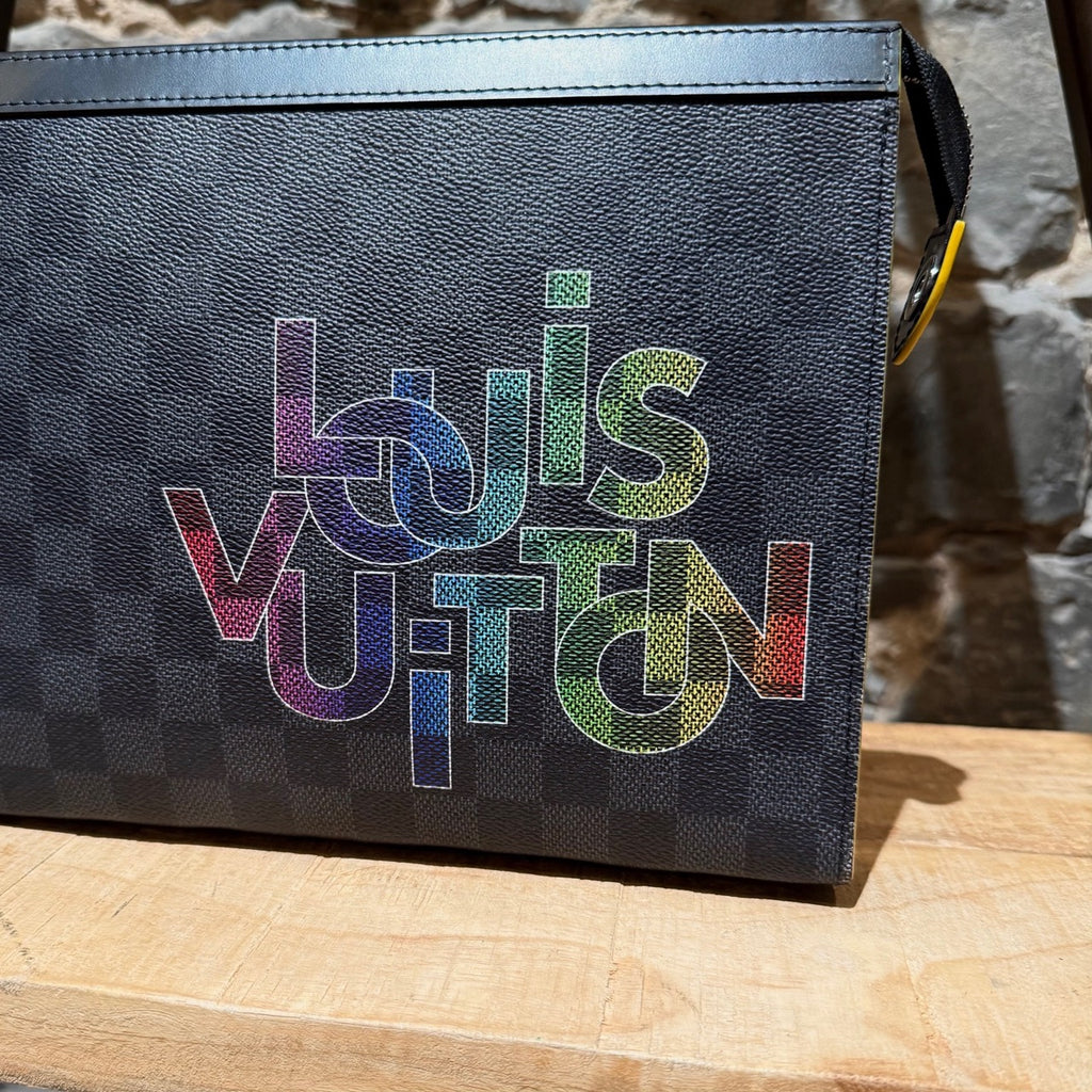 Branded print of Louis Vuitton Damier Graphite Rainbow Logo Pochette Voyage MM