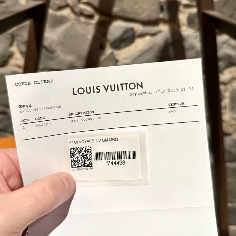 Purchase receipt and tag of Louis Vuitton Etui Voyage Brown Monogram GM Pouch