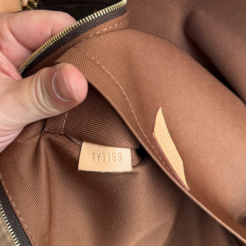 Serial number tag of Louis Vuitton Etui Voyage Brown Monogram GM Pouch