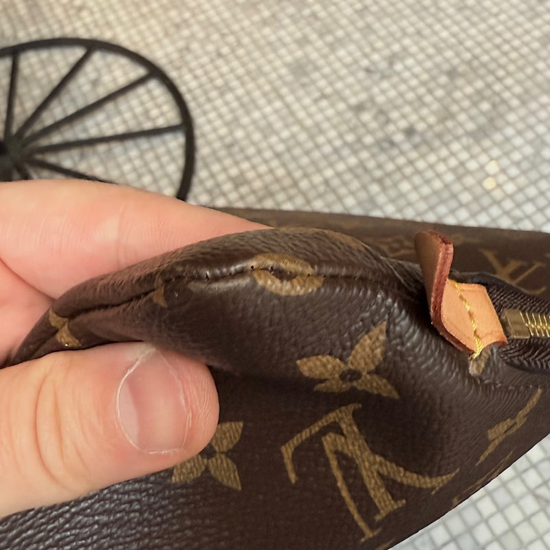 a corner of Louis Vuitton Etui Voyage Brown Monogram GM Pouch