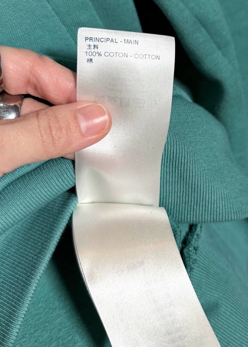 Material label of Louis Vuitton FW21 Teal Green Pin Logo Embroidered Hoodie