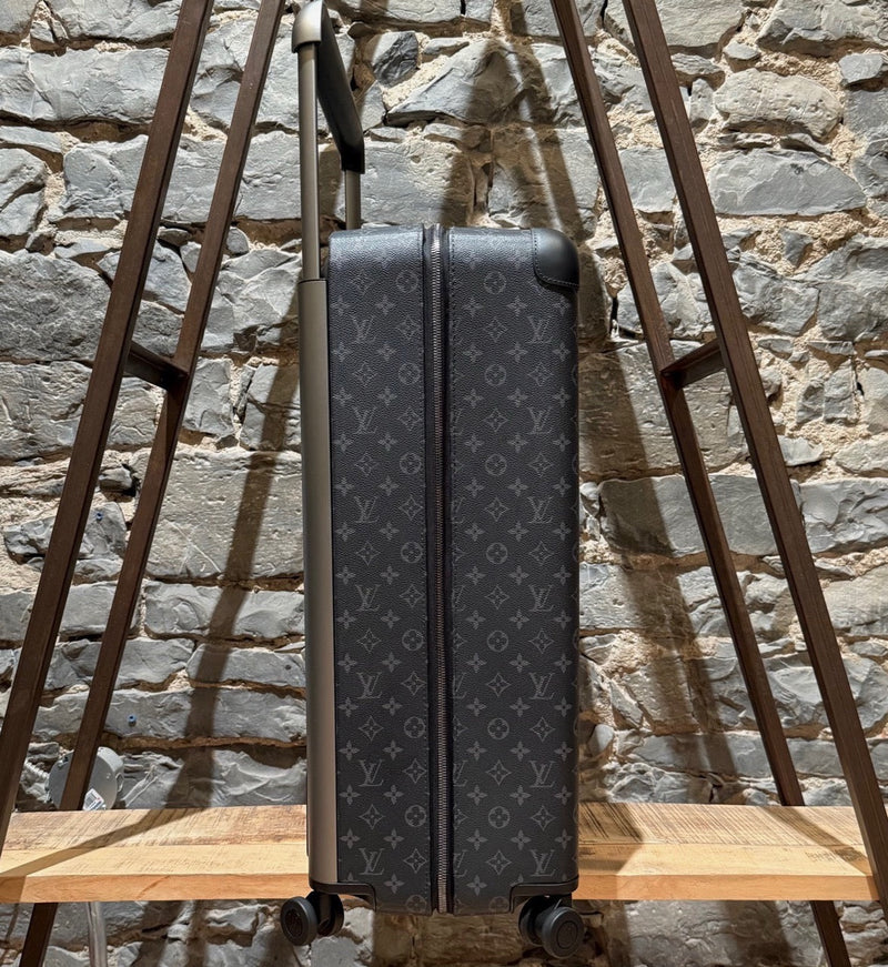A side view of Louis Vuitton Horizon 70 Monogram Eclipse Luggage