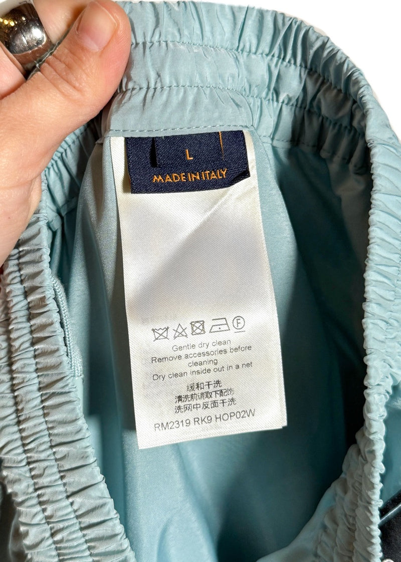 Size and care label of Louis Vuitton SS23 Light Teal Mix Material Wool Blend Track Pants