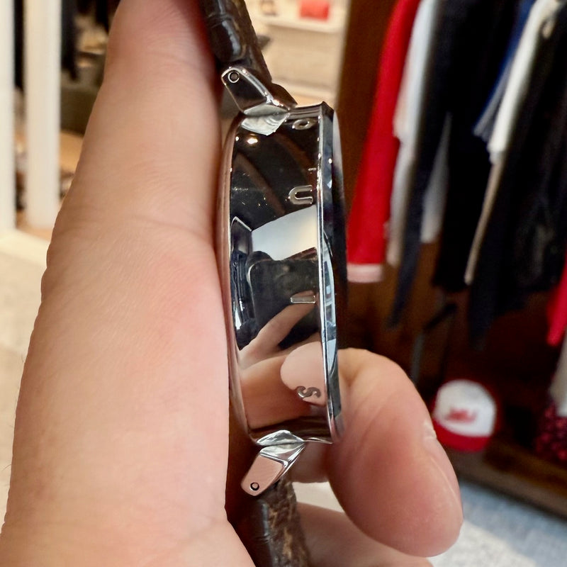 A side view of Louis Vuitton QA050 Tambour Horizon Monogram Watch