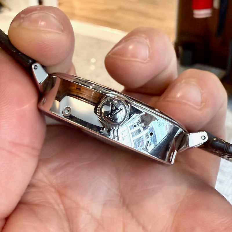 A side view of Louis Vuitton QA050 Tambour Horizon Monogram Watch