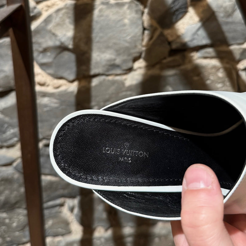 A branded insole of Louis Vuitton White Leather Topmost LV Logo Heeled Mules