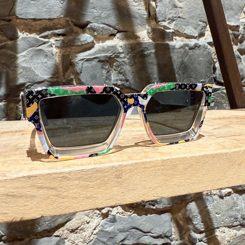 Side front view of Louis Vuitton Z2027W 91P FW23 Multicolored Camo Monogram Acetate 1.1 Millionaires Sunglasses
