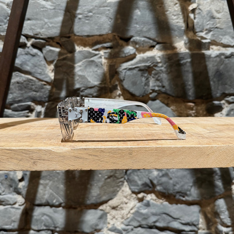 A side view of Louis Vuitton Z2027W 91P FW23 Multicolored Camo Monogram Acetate 1.1 Millionaires Sunglasses