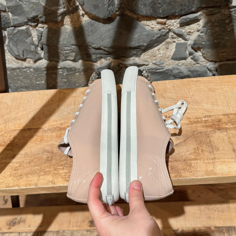 Side-by-side view of Miu Miu Nude Pink Patent Crystal Cap Top Sneakers