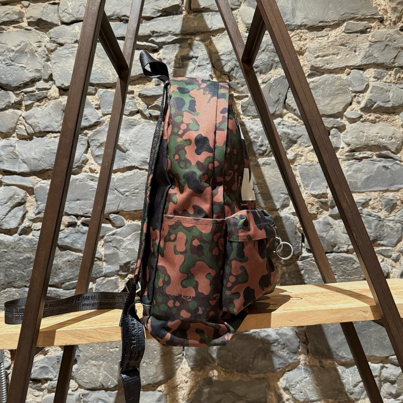 A side view of Off-white Green Camouflage Arrow Print Backpack
