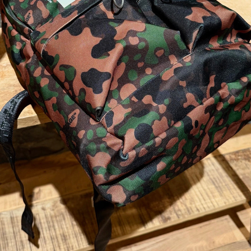 Bottom corners of Off-white Green Camouflage Arrow Print Backpack